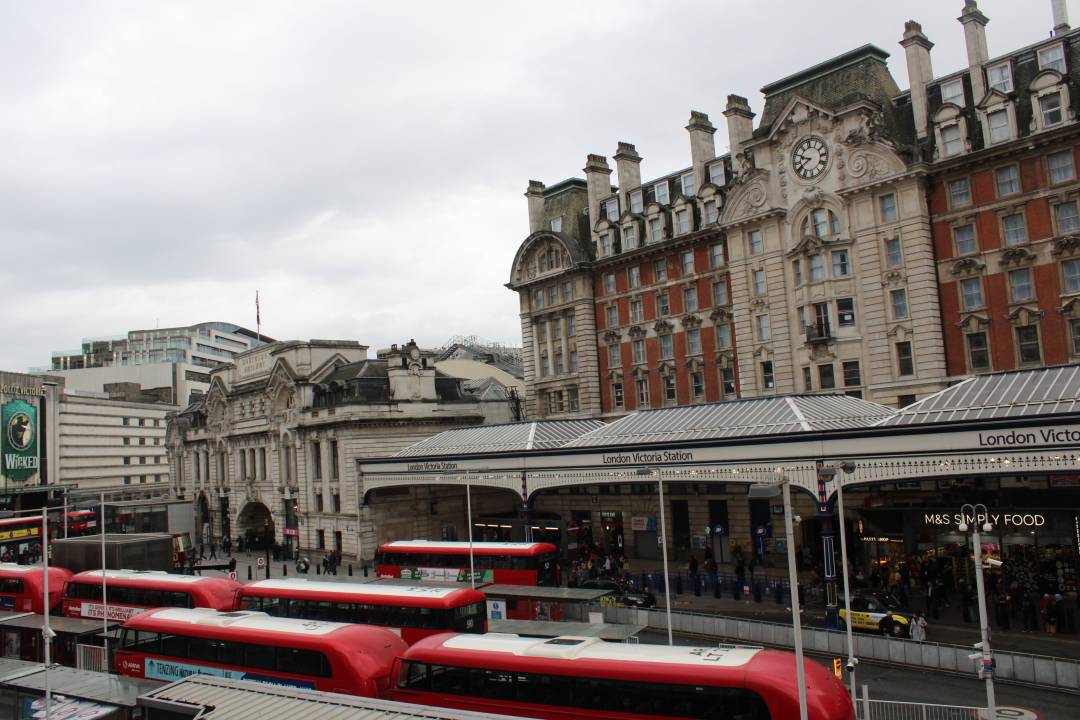 Photo Of Victoria Train Station With Lots Of Red Buses In The Foreground