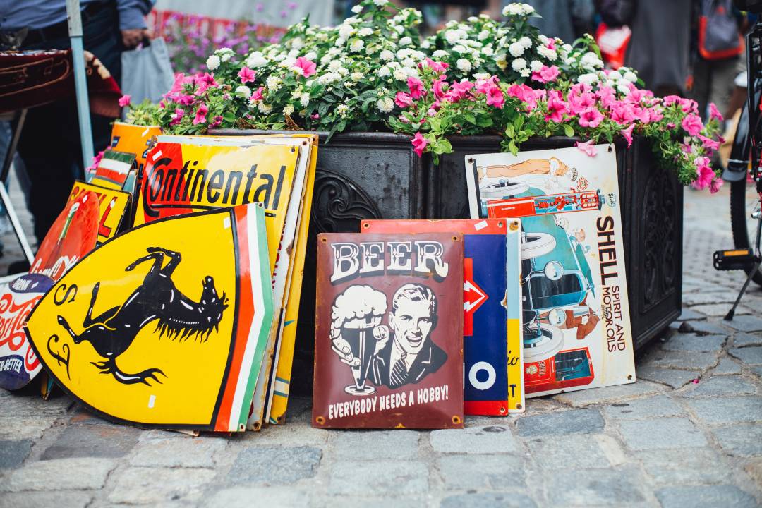 Metal Signs For Sale At A Street Market
