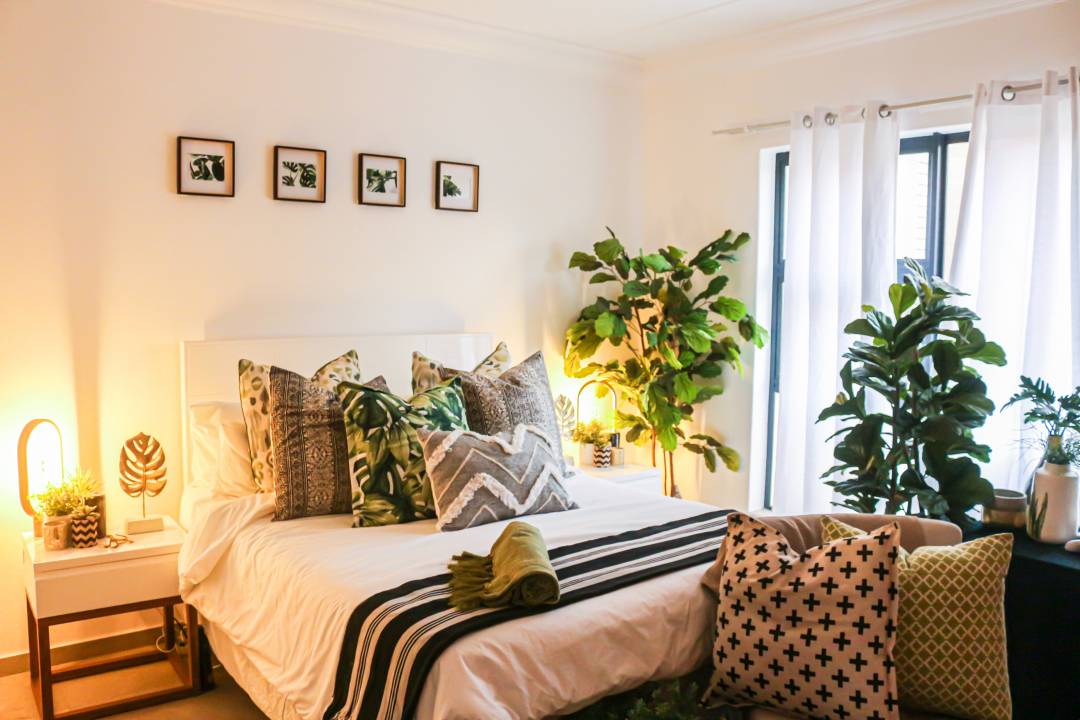 Stylish Bedroom With Plants And Furniture