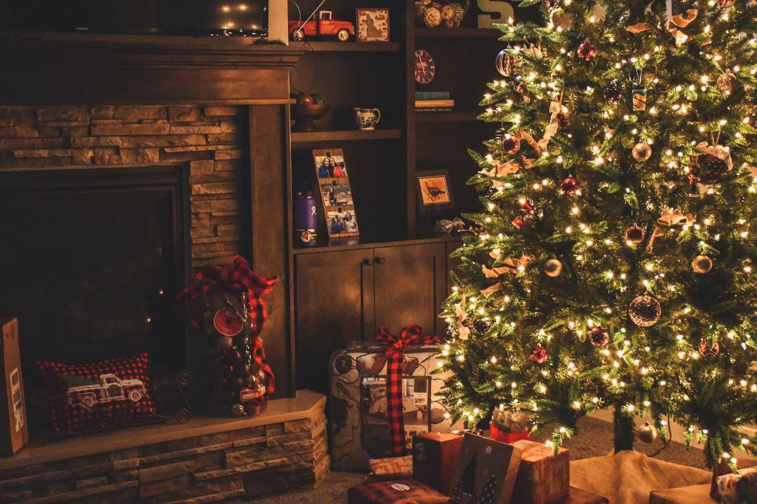 Christmas Tree With Lights And A Fireplace