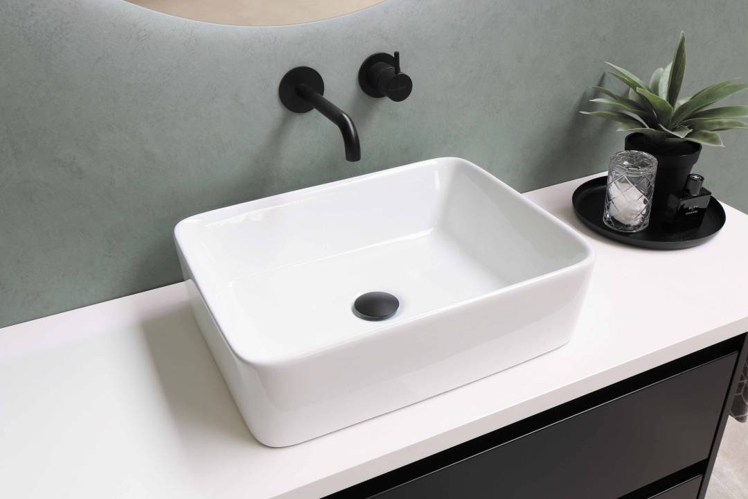 White Basin On A Vanity Unit With Black Taps