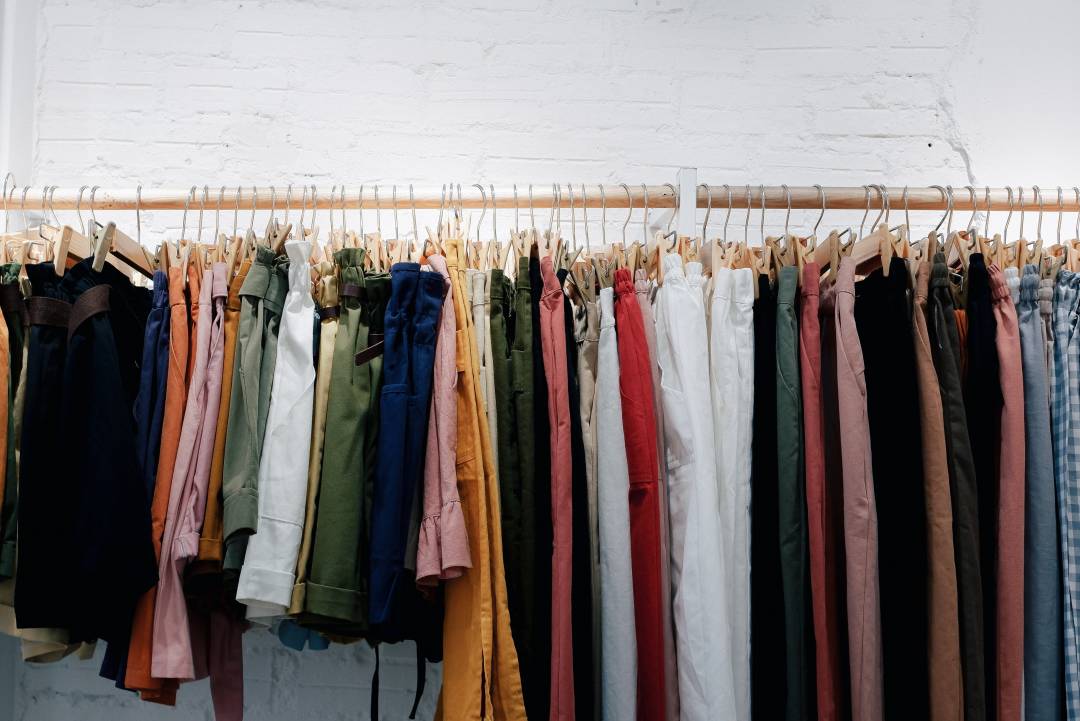 Colourful Clothes Hanging On A Rail