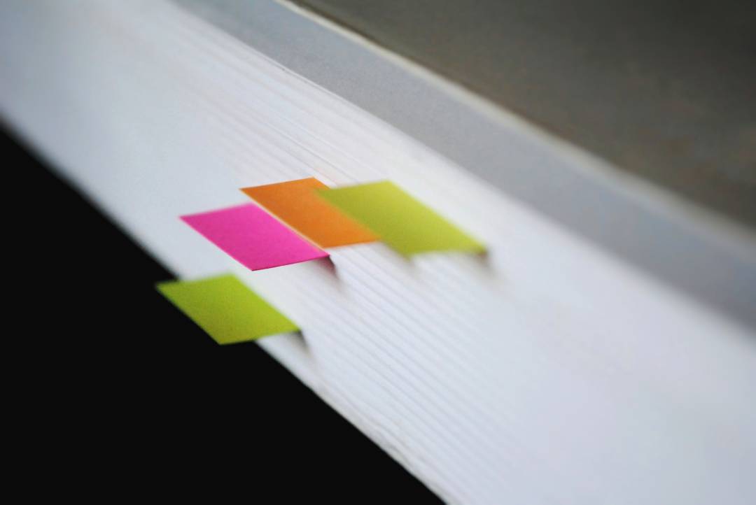 Post Its Marking Important Pages In A Document