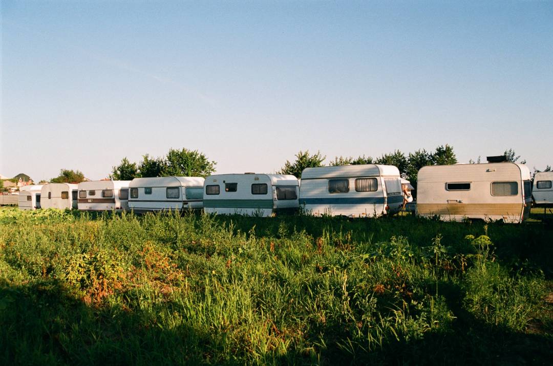 Image of a row of caravans in a fields