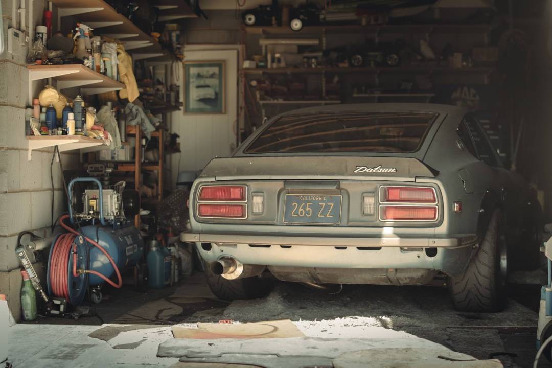 Classic Car In Garage With Assorted Tools