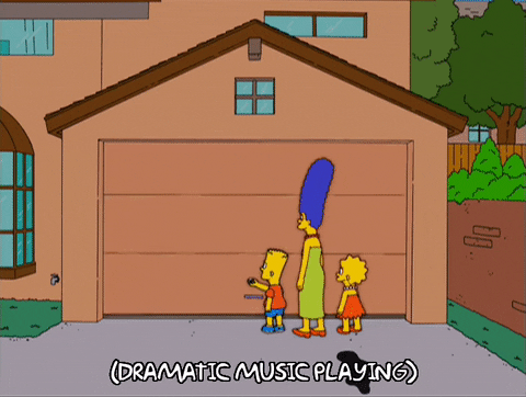 Simpson's Cartoon Standing In Front Of An Opening Garage 