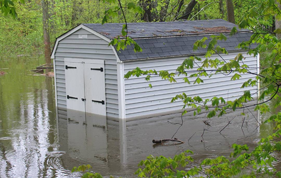 Garage Surrounded And Part Submerged In Water